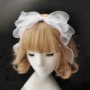 Milk white multi-layered ruffled organza bow lolita hair hoop with small pearl accents shown on mannequin head, translucent airy fabric with delicate construction