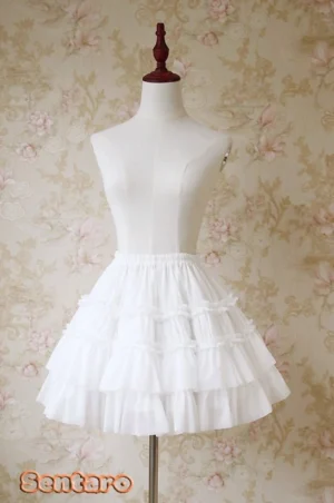 Milk white tiered ruffle Lolita shorts skirt with cascading ruffles and elastic high waist, full front view classic silhouette