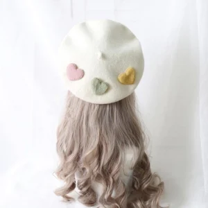 Off-white milk white sweet lolita heart-appliqued wool beret with three pastel hearts on mannequin wig, back top view showcasing smooth wool fabric and elegant design