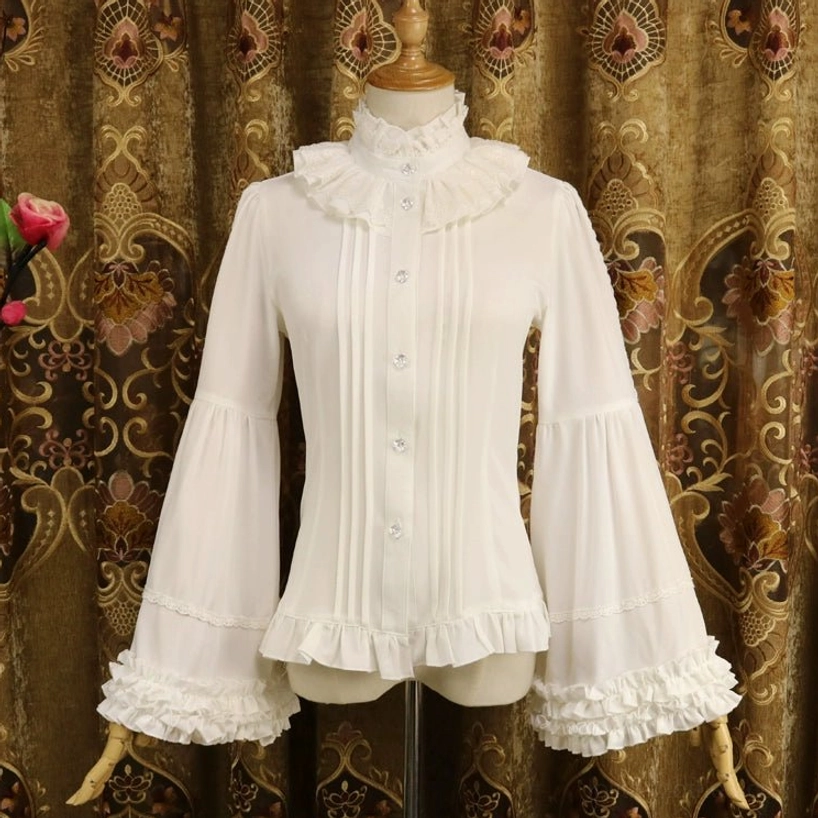 Milky white classic Lolita blouse with adjustable Hime sleeves displayed on dress form front view, featuring ruffled stand collar, crystal decorative buttons, and layered ruffled hem against vintage curtain backdrop