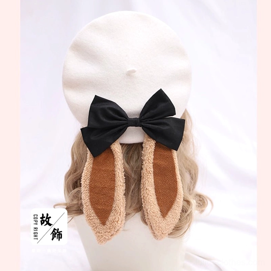 Milky white lolita beret with brown fuzzy edged bunny ears and black bow decoration - rear mannequin display