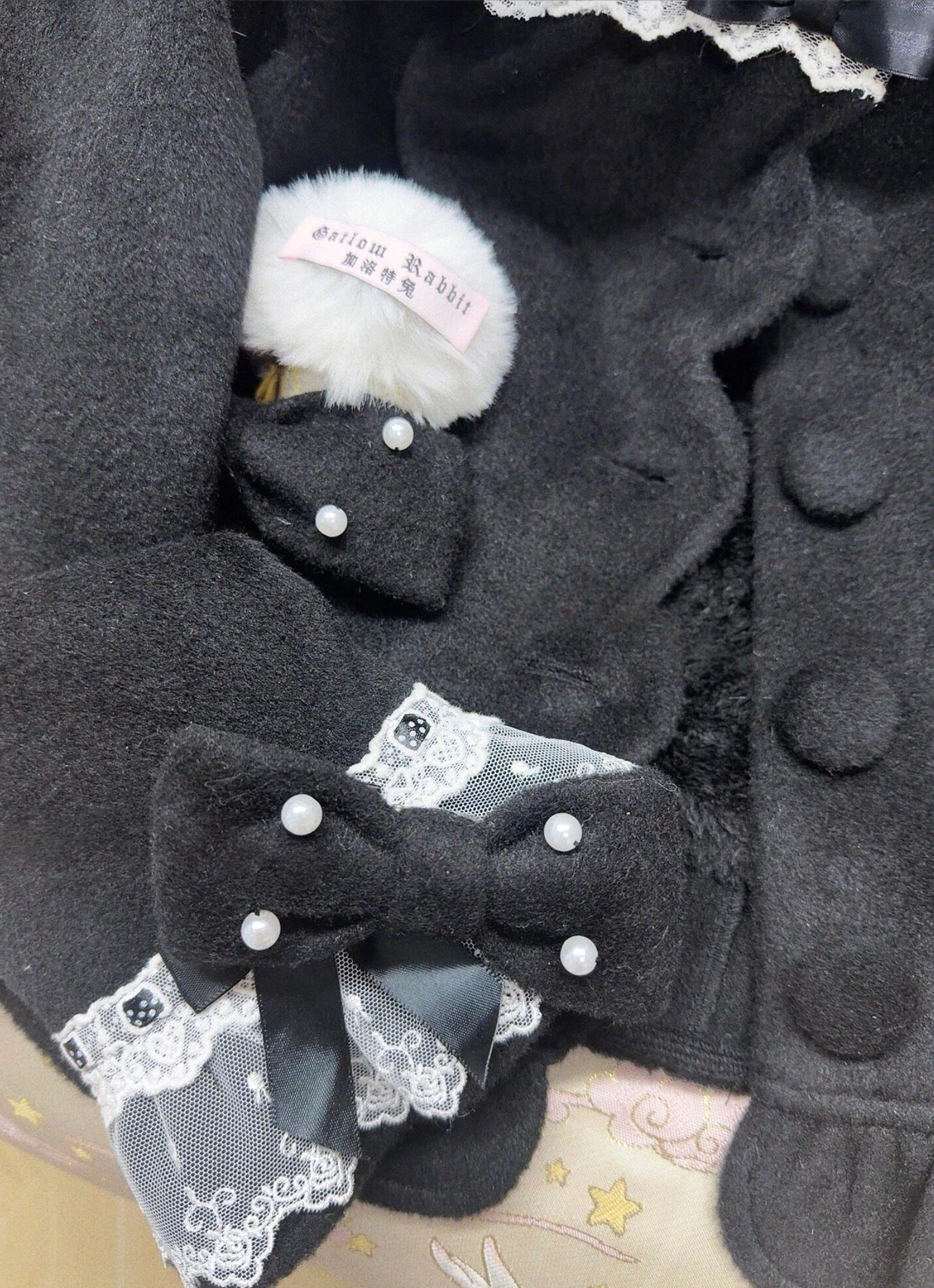 Milky white lolita coat with beige tint front view showcasing oversized fit lace peter pan collar and detachable bow design detail