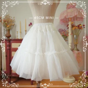 Mini white A-line lolita petticoat 45cm length with tiered ruffled tulle layers front full view on display mannequin vintage studio