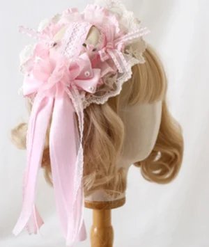Pink mini bowler hat Lolita headdress with lace trim displayed on blonde mannequin head showing Victorian-inspired silhouette
