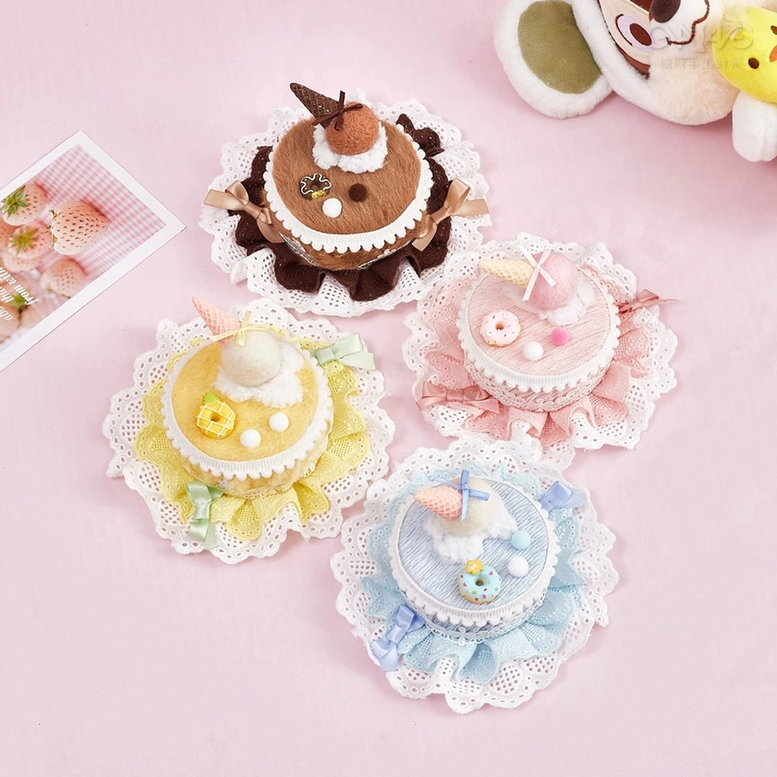 Mini cake themed Lolita hair clips four variants with lace ruffle base and tiny sweet dessert ornament charms flat lay