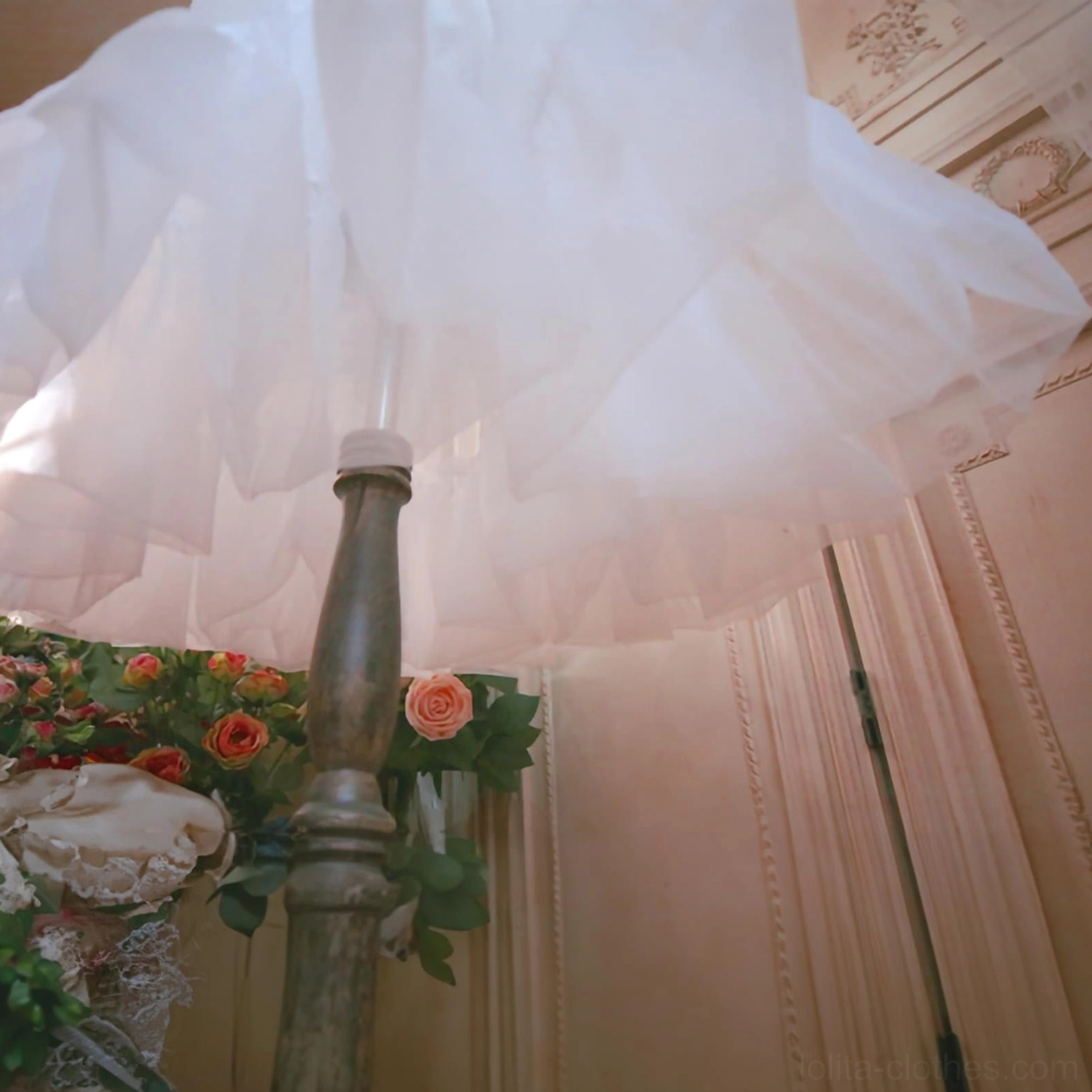 Low-angle upward close-up of white Lolita petticoat displaying sheer lightweight tulle material voluminous layered construction