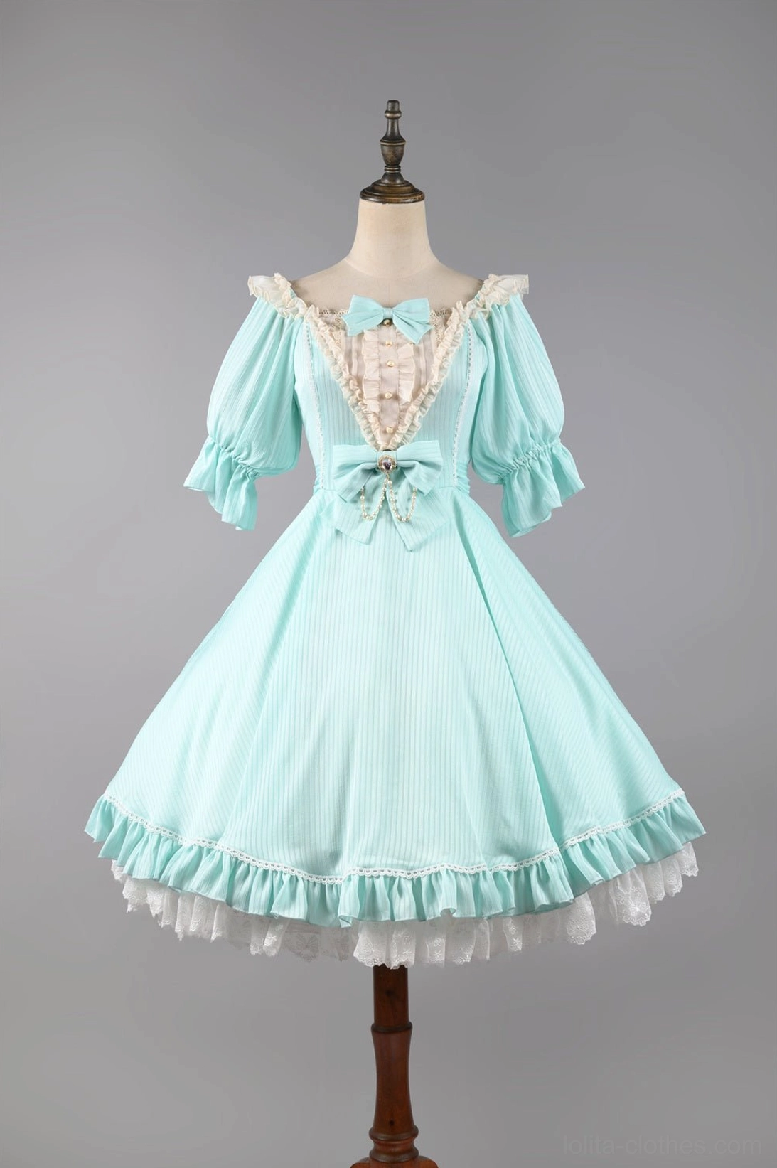 Mint blue classic lolita OP dress full-body front mannequin view puff sleeves square neckline lace trim front bow ruffled hem studio