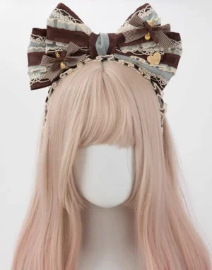 Mint chocolate striped oversized bow lolita KC hair headband with brown bows, lace trims, and metal charm pendants worn on blonde wig mannequin