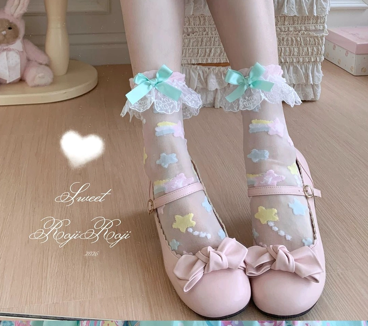 Mint green bow lolita socks with pastel star embroidery lace cuff worn with pink round-toe mary janes