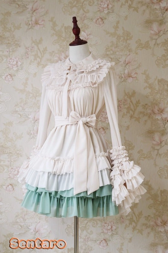 Mint green gradient Lolita dress featuring cream white long-sleeve top with lace cuffs, layered ruffled hem and waist bow
