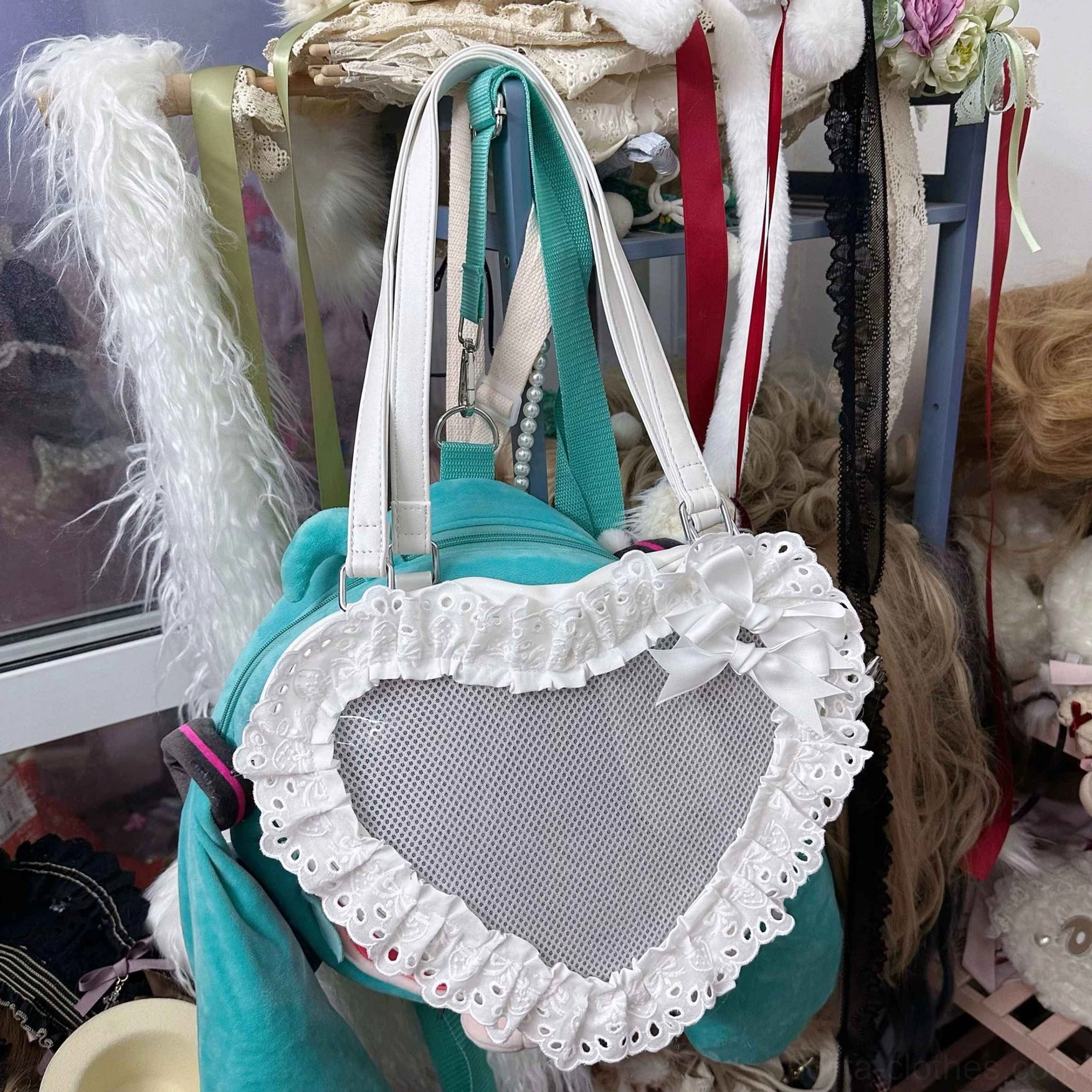mint green heart-shaped lace lolita tote bag front side close-up white ruffled lace mesh window bow