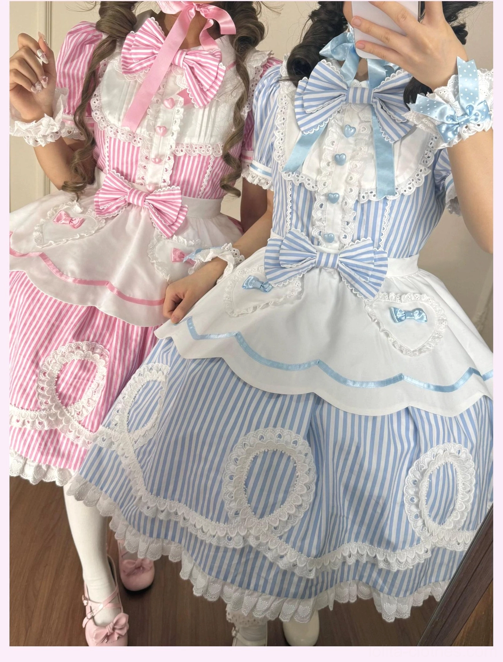 Model wearing blue striped lolita OP dress with detachable apron showing day wear styling potential