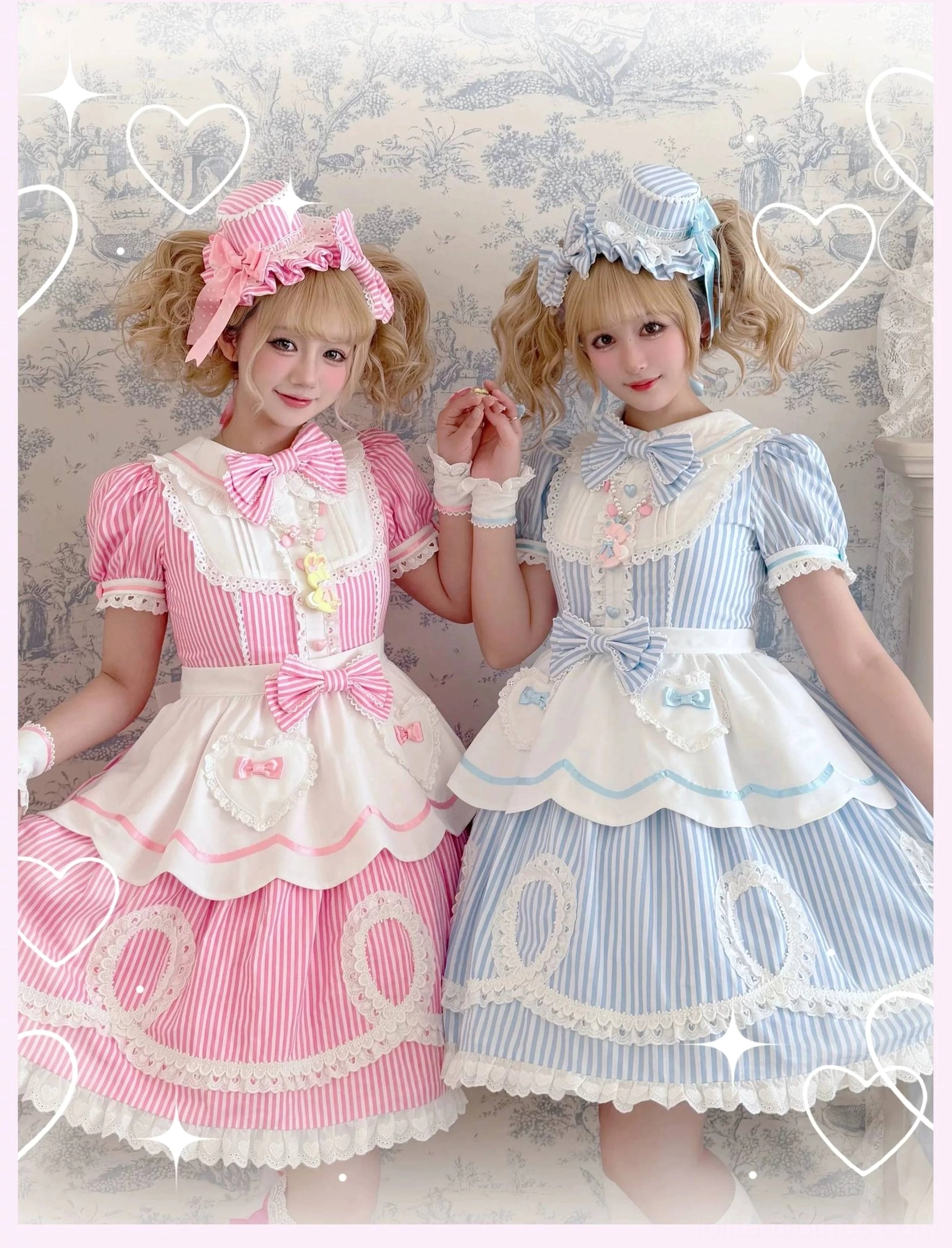 Two female models in striped lolita OP dresses without bonnets showing heart-shaped bow neck decorations and detachable aprons with vintage decor background