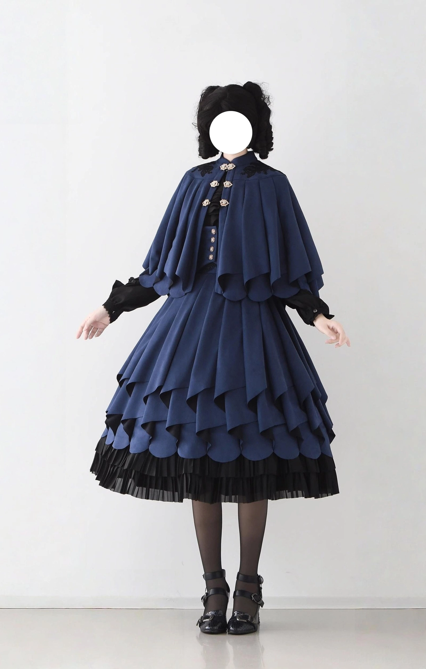 Navy blue classic Lolita SK set with detachable cape featuring vintage-inspired gold buttons and layered ruffled hem details, studio shoot