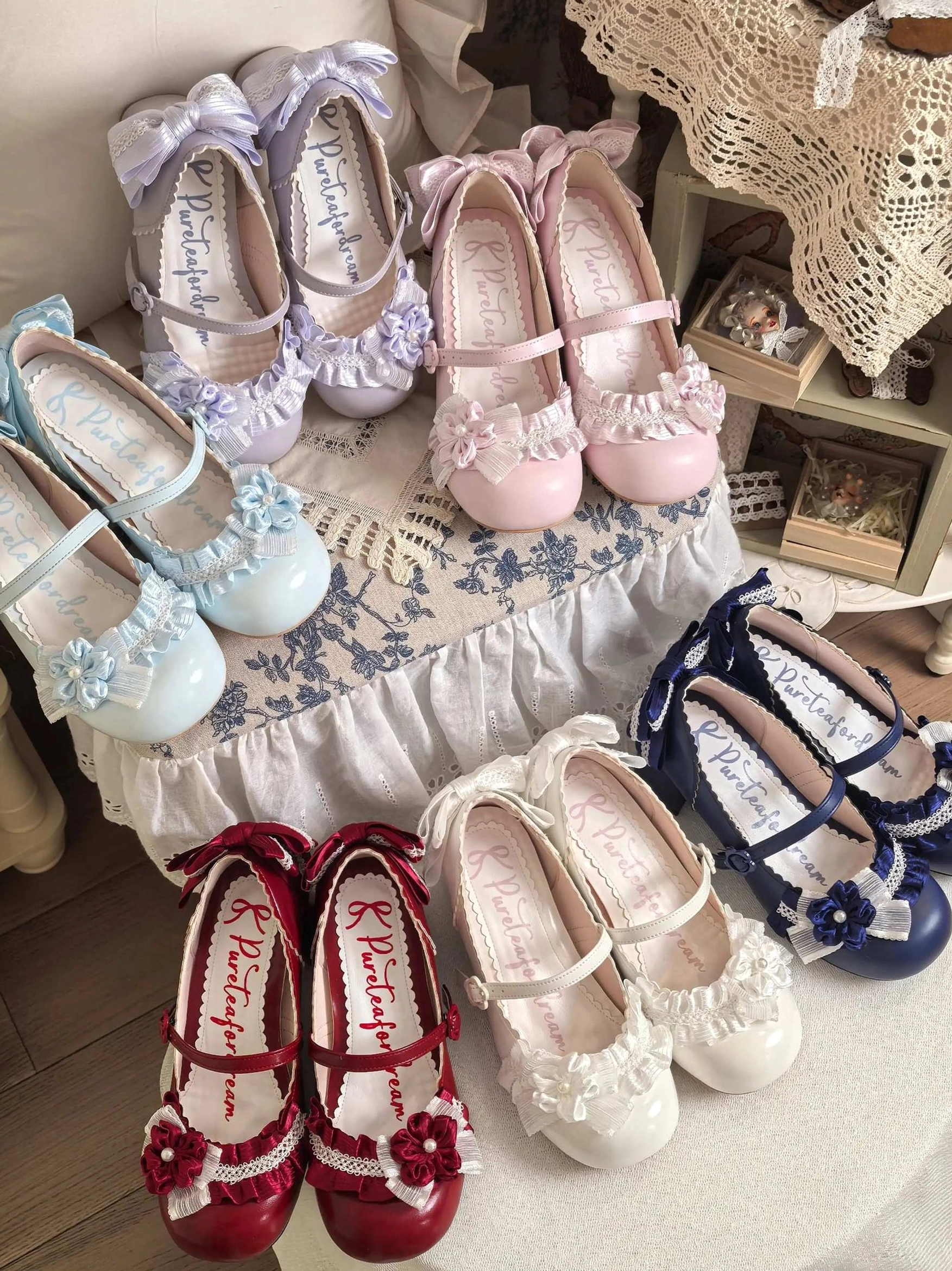 moonlit sakura sweet lolita mary jane heels all four color variants navy blue milky white pink lavender flat lay wooden vintage table