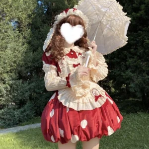 Mushroom red kawaii lolita OP dress with white polka dot bubble skirt, cream ruffled trim, detachable puff sleeves and matching bonnet, worn outdoors with white lace parasol