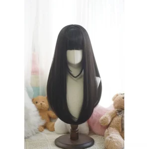Natural black long straight lolita wig with blunt bangs displayed on mannequin in cozy indoor setting with teddy bear backdrop
