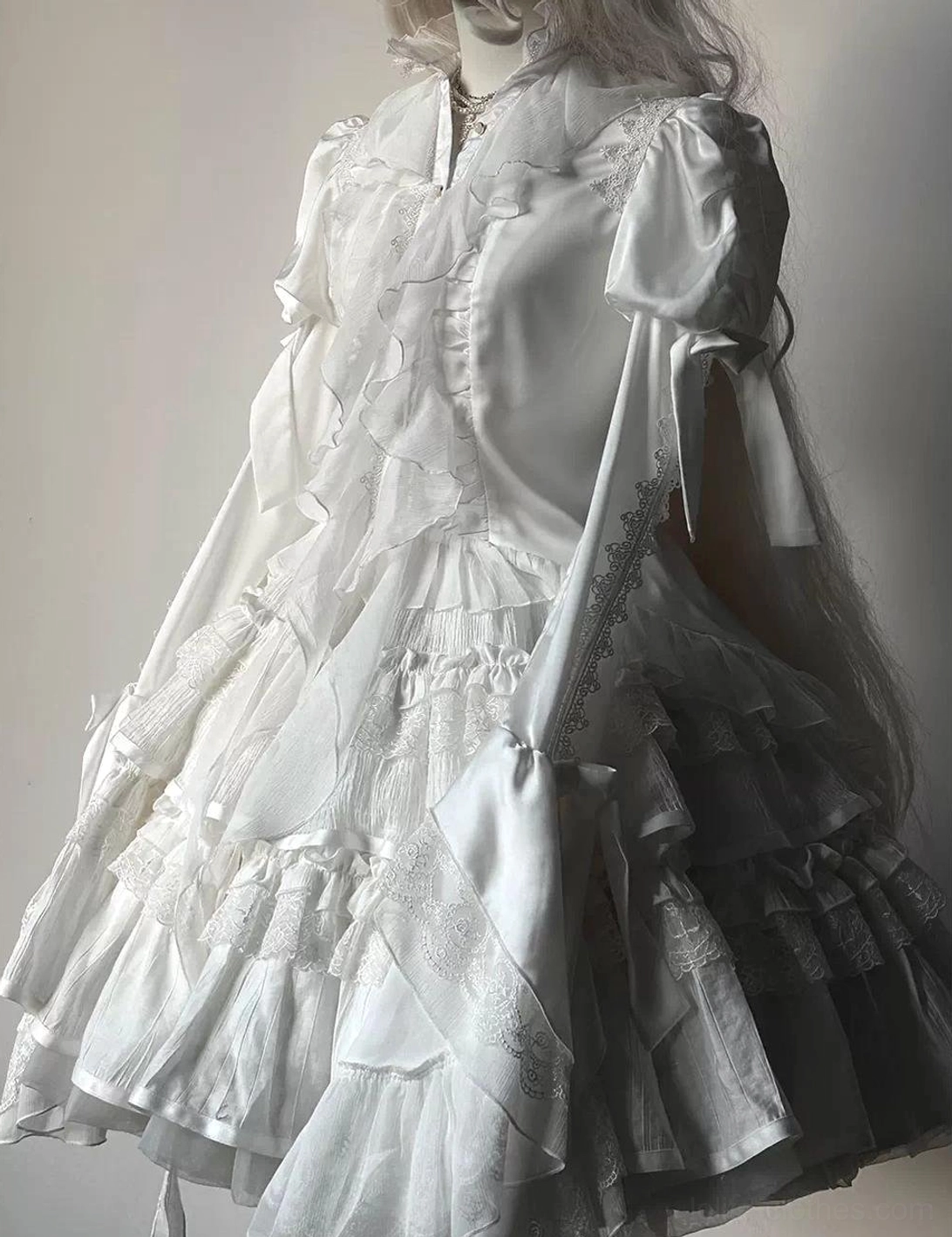 Navy blue gothic lolita blouse front angle showing stand collar with ruffled design, button closures, and juliet sleeve volume paired with hime sleeve elegance
