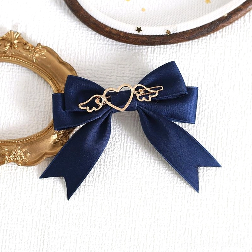 Navy blue handmade lolita bow hair clip with ornate gold heart-wing metal decoration romantic aesthetic
