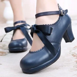 Navy blue handcrafted lolita satin Mary Jane high heel shoes with scalloped collar, cross ribbon bow, and ankle buckle strap worn on carpeted flooring, showcasing chunky block heel and decorative design details