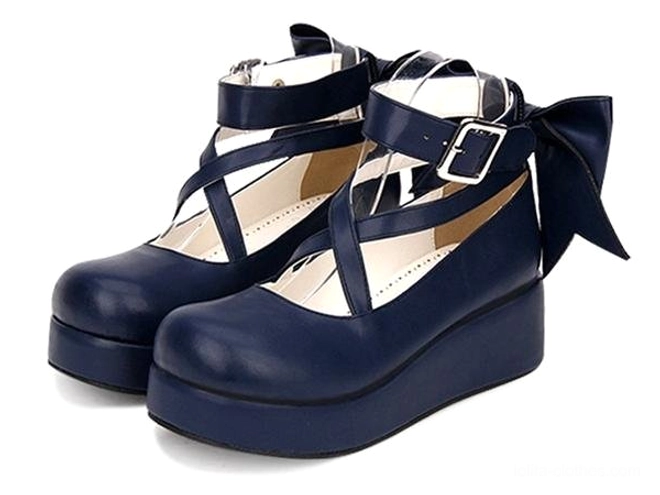 Navy blue platform Lolita leather shoes with crisscross ankle straps and back bow three-quarter front view