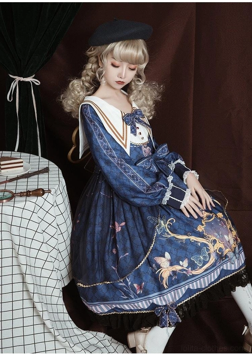 Navy sailor collar classic lolita op dress side sitting full-body view on model with black beret, sitting beside checkered table, fitted waist design, flared skirt with vintage print, lace-trimmed cuffs