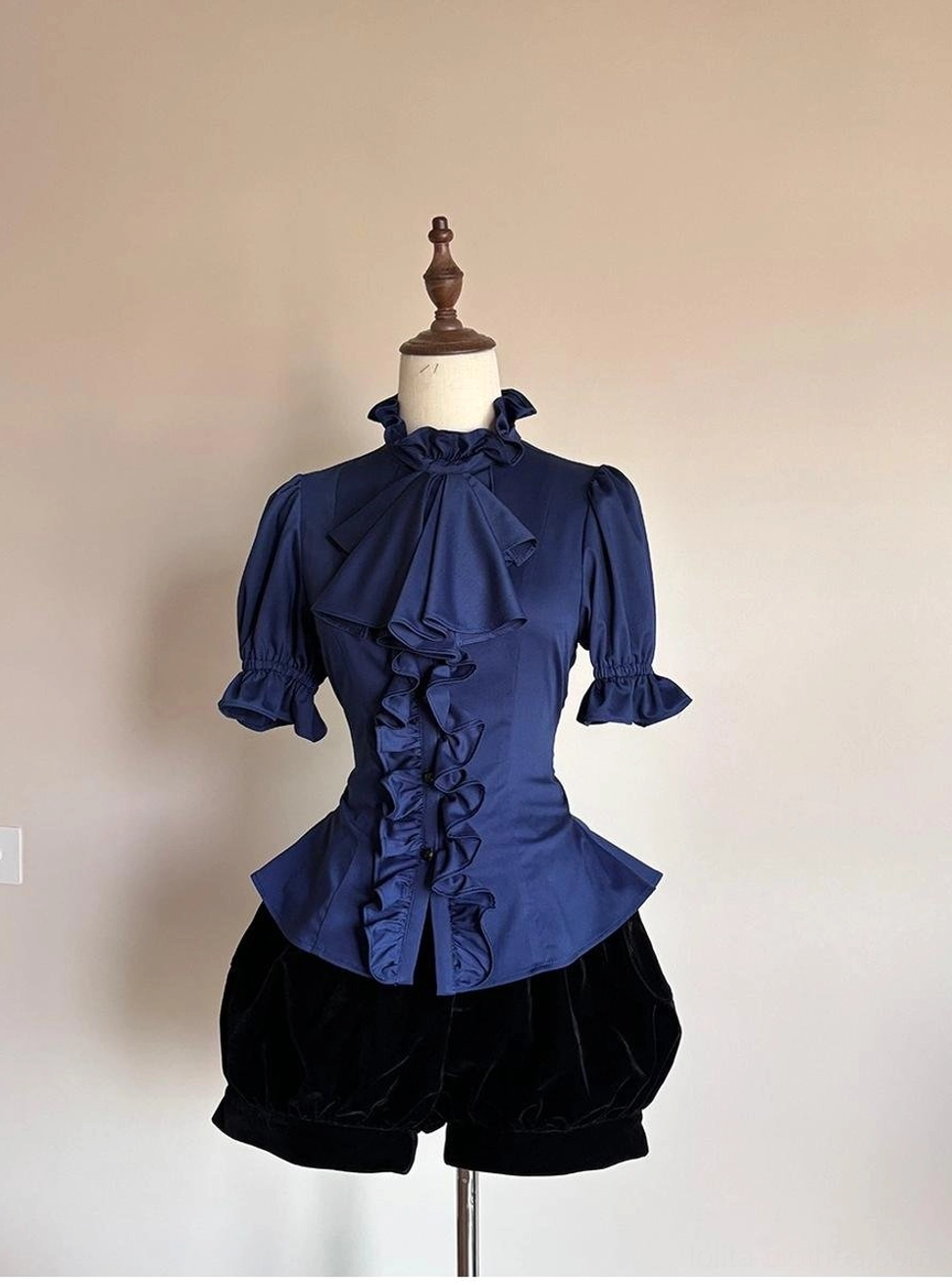 Front flat display of navy blue Gothic Lolita short-sleeved ruffled shirt with stand collar detachable bow and front ruffle placket on dress form
