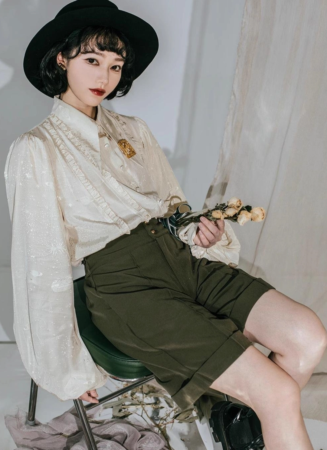 Navy blue Lolita blouse paired with black ruffled skirt and bow tie accessory half-body model shot highlighting elegant retro styling versatility