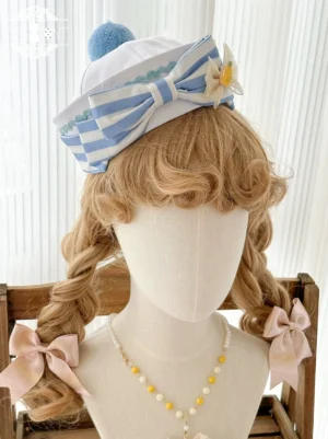 Navy lolita mini hat with blue-white striped bow pom-pom lemon flower decoration on blonde curly mannequin with pink side bows beaded necklace styling