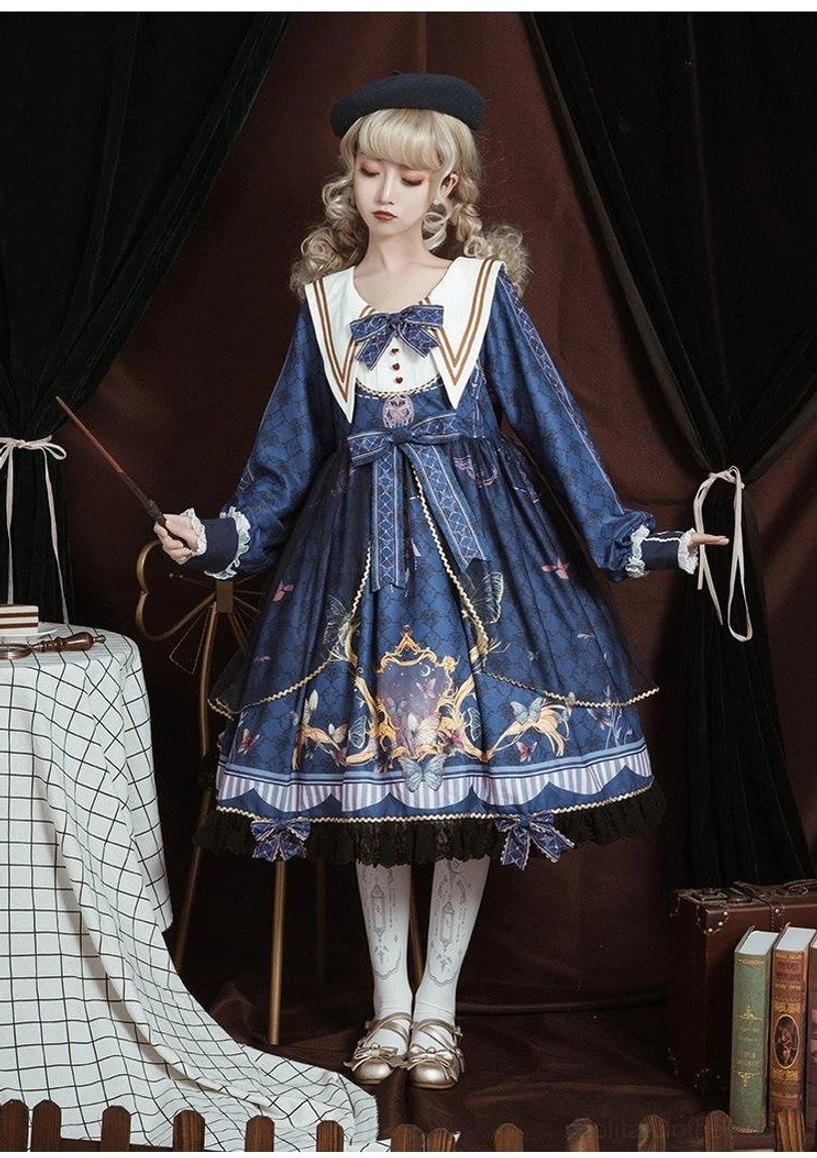 Navy sailor collar lolita one-piece dress side front full-body view on model with black beret, holding magic wand, flared a-line skirt with striped lace hem, big waist bow accessory