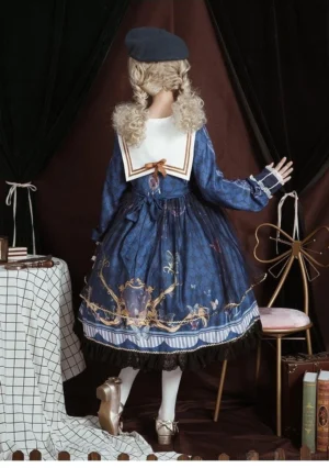 Navy blue sailor collar lolita one-piece dress back view on mannequin, vintage baroque print on skirt, black lace underskirt hem, long puff sleeves with lace cuffs, matching black beret
