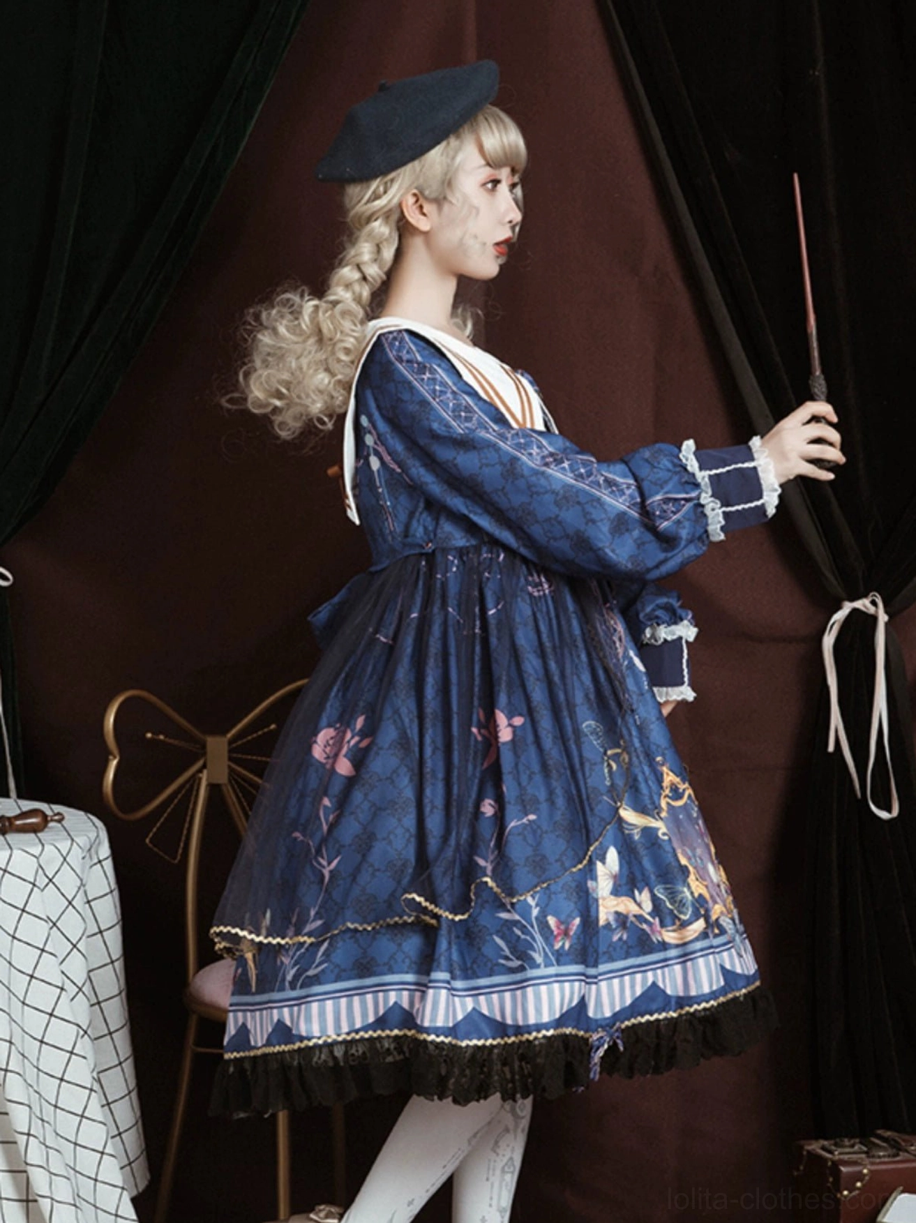 Navy sailor collar lolita one-piece dress side full-body view on model with black beret, holding magic wand, delicate small floral print instead of large baroque pattern, same sailor collar style