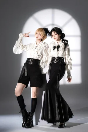 Ouji lolita satin blouse and bottom set white blouse with black shorts and black fishtail skirt full standing portrait vintage arched window backdrop