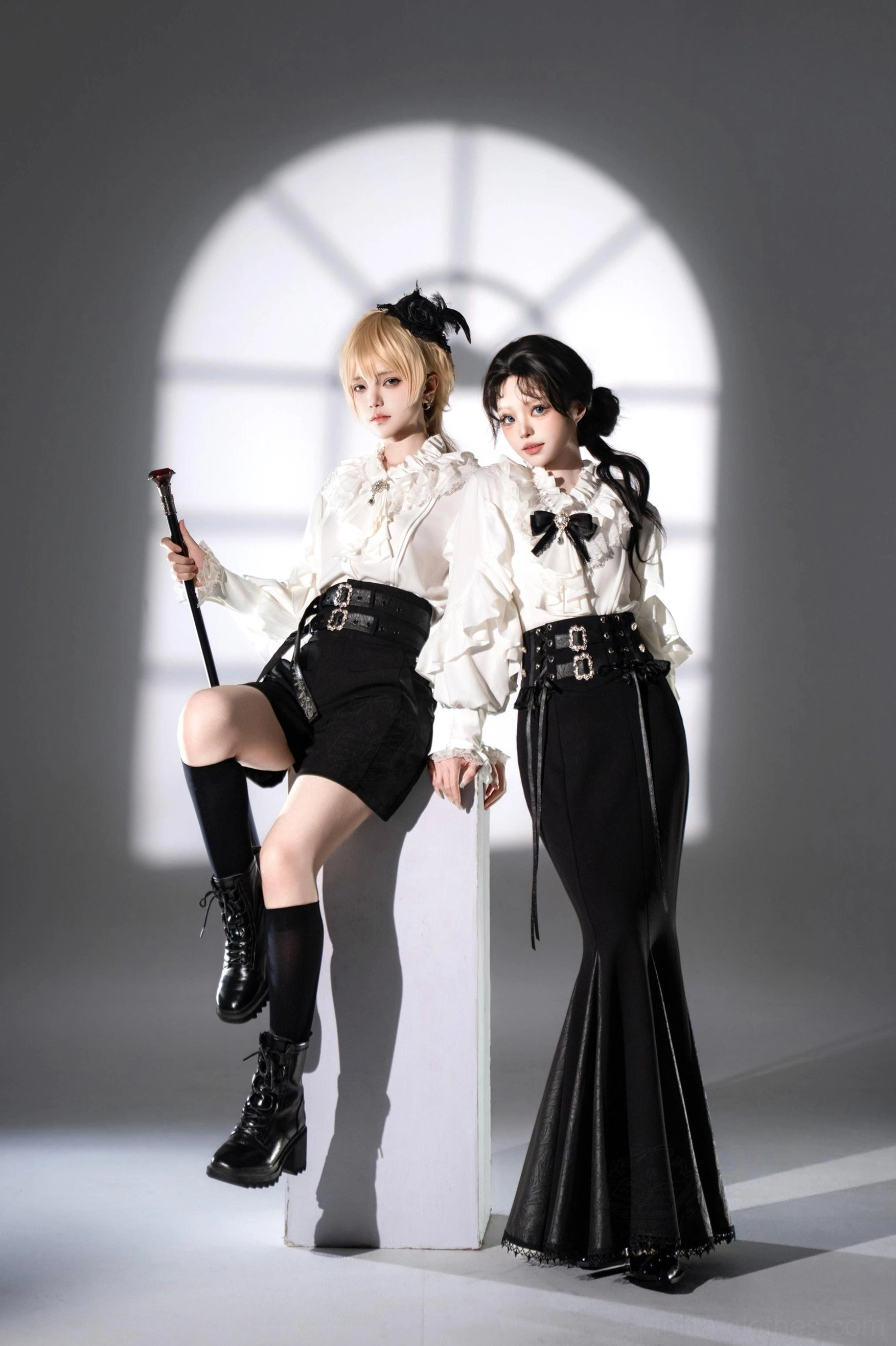 Ouji lolita blouse and bottom set sitting full view white ruffled satin blouse paired with black shorts and fishtail skirt waist belt coordination