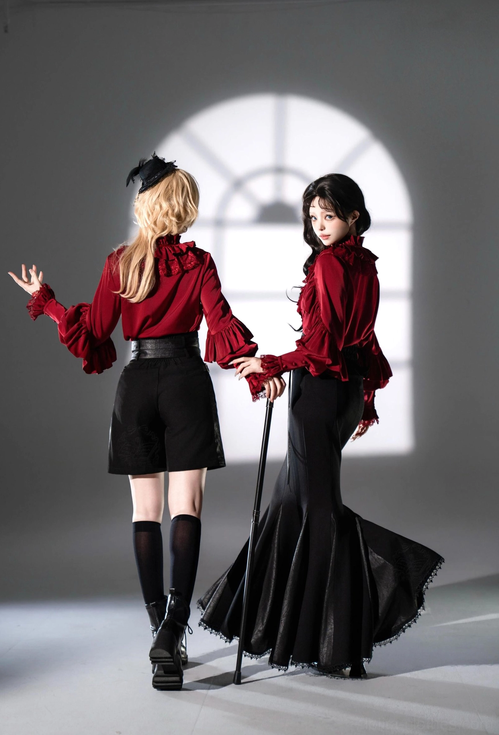 Ouji lolita set back three-quarter view wine red ruffled blouse high-waisted black belt accessories vintage studio setting