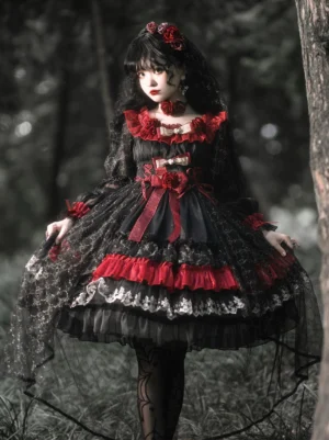 Night of Berea black and red gothic lolita OP dress full-body front view on model in dark forest outdoor setting, showcasing tiered ruffle skirt, sheer lace sleeves, and multi-layered design