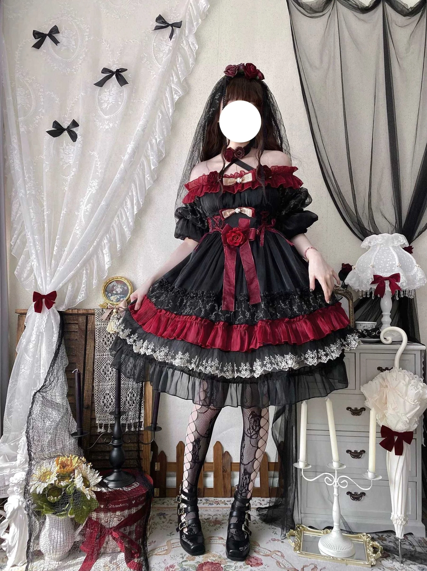 Black and red gothic lolita OP dress overhead view showing hem circumference, layered tulle construction, and lace pattern details for lolita fashion coordination