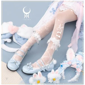 Overhead flat lay of elegant white Lolita stereo floral sheer tights with delicate bird and rose prints, featuring ruffled lace ankle cuffs with small bows, styled on model wearing pastel sweet Lolita dress and blue Mary Jane shoes with bunny hair accessories
