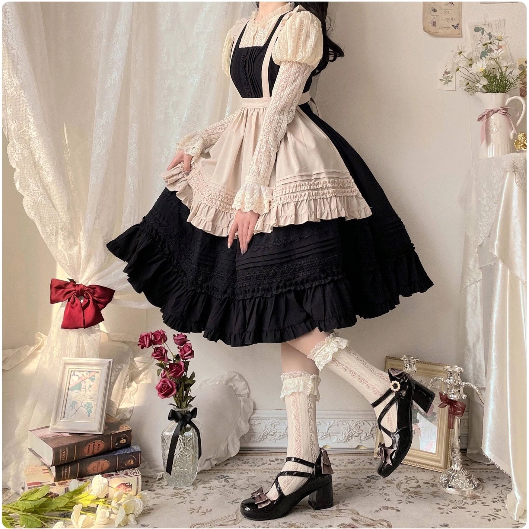 Black Lolita JSK dress with beige ruffled apron set on real female model wearing puff sleeves Mary Jane shoes vintage home
