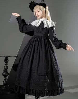 Nun-style gothic lolita OP dress front view on blonde model wearing black dress with white lace collar and ruffled sleeves