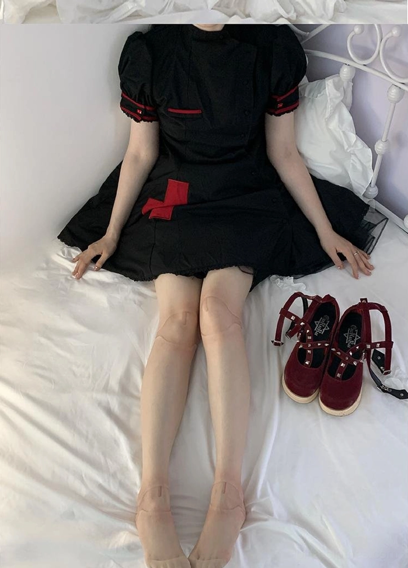 Black nurse Lolita dress joint printed stockings wine red platform shoes bed seated view