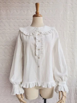 Off-white cotton Lolita blouse with Peter Pan ruffled collar front view on dress mannequin featuring ruffled placket pearl buttons and woven stripe texture