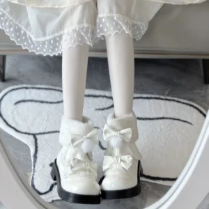 Off-white patent leather Lolita winter boots with fuzzy collar and double white pompom bows styled with white stockings and Lolita coordinate