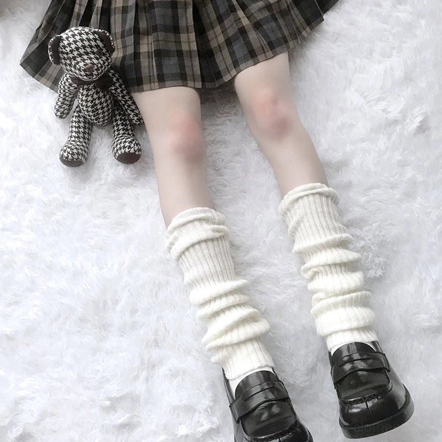 Off-white mid-calf slouch lolita leg warmers loose ribbed texture front view fluffy background plaid teddy