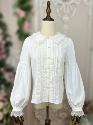 Off-white sweet Lolita doll collar blouse with Peter Pan collar and lace cuffs, full front view on dress mannequin, showcasing ruffled placket and bishop sleeves