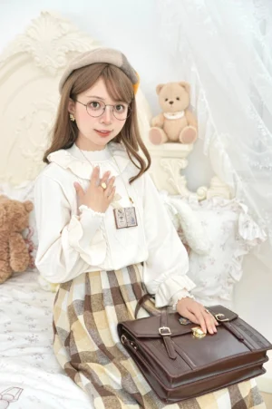 Off-white sweet lolita inner wear sweater styled with beret and plaid skirt bedroom aesthetic photography