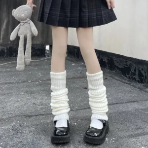 Off-white thigh-high slouch lolita leg warmers in ribbed knit fabric front full view legs plaid jk skirt