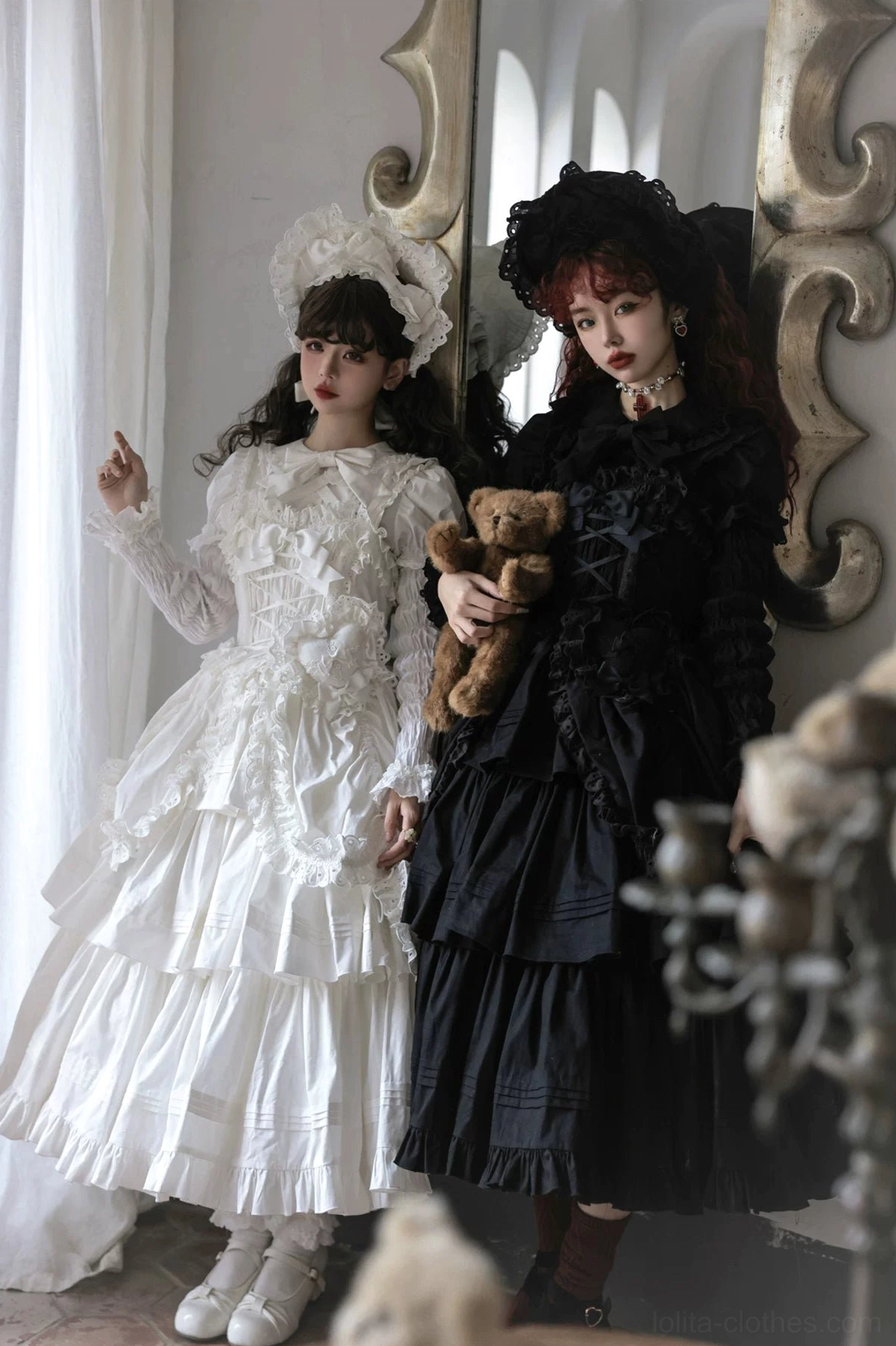 Back full-body mannequin shot of off-white vintage Lolita dress with intricate lace bodice, full layered skirt, and back strap design