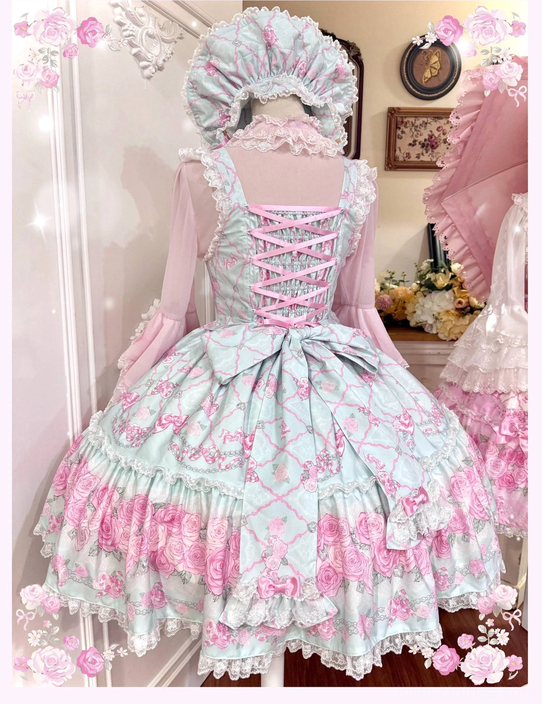 Back view of vintage rose garden lolita jsk dress featuring lace-up corset back design and large back waist satin bow, demonstrating classic old school lolita construction with full layered tulle skirt and delicate lace trim
