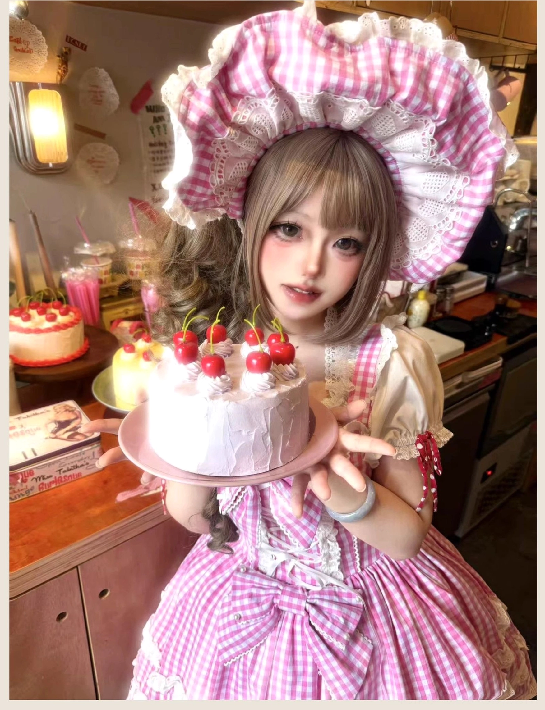 Pink gingham old school Lolita JSK dress detailed close-up showing lace-up corset bodice construction, layered ruffle skirt with white petal trim, and adjustable back shirring feature